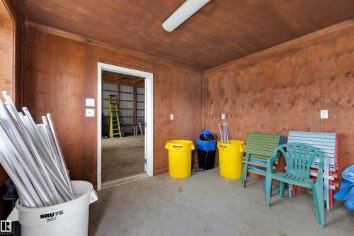 Interior space featuring wood paneling on walls and ceiling - 28125 Highway 587, Rural Red Deer County, AB 