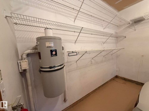 Central vacuum system with wall-mounted unit and integrated piping in the GARAGE! - 102 4610 50 Avenue, Stony Plain, AB 