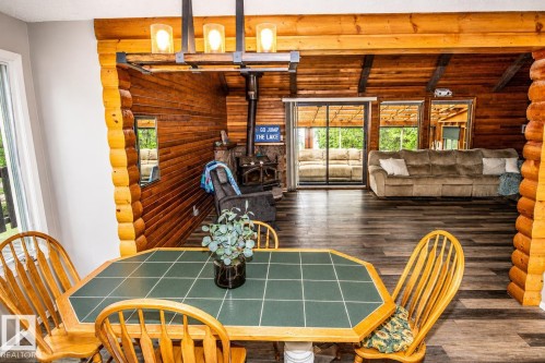 Wood-finish flooring throughout the open concept space - 61 Stang Cres, Rural Two Hills County, AB 