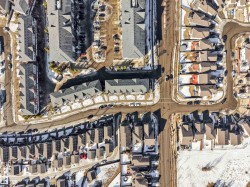 Aerial perspective showcasing a residential community with varied housing styles - 