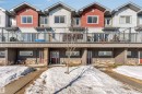 Townhome exterior with a mix of vertical and horizontal siding - 1624 33A Street, Edmonton, AB 