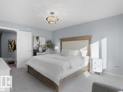 Bedroom featuring light grey walls and light grey carpeting - 207 41 Avenue, Edmonton, AB 