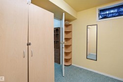 Light wood-finish storage cabinets with silver handles - 