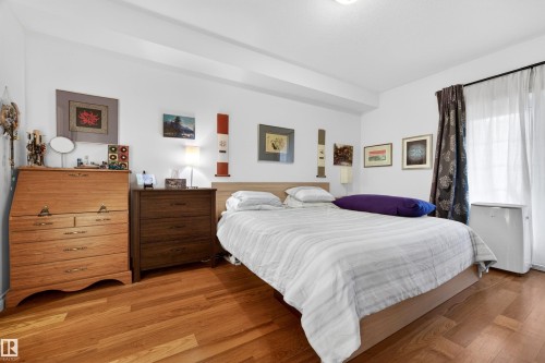 Hardwood flooring complemented by white walls - 304 10116 80 Avenue, Edmonton, AB 