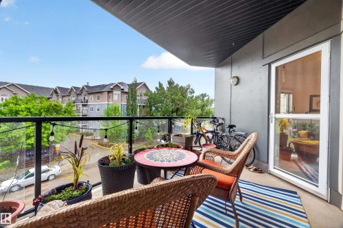 Private balcony featuring a glass railing and concrete flooring - 304 10116 80 Avenue, Edmonton, AB 