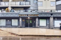 Modern building exterior featuring a stone facade and prominent entry - 