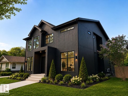 Modern two-story residence featuring a dark vertical siding exterior and multiple large pane windows - 9243 148 Street, Edmonton, AB 