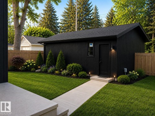 Modern outbuilding with vertical black siding and an asphalt shingle roof - 9243 148 Street, Edmonton, AB 