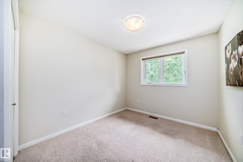 Neutral-toned carpet flooring - 50 303 Twin Brooks Drive Nw, Edmonton, AB 