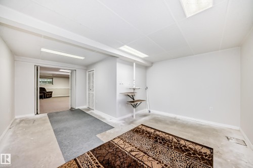 Versatile open area featuring recessed lighting, a drop ceiling, and light-toned walls - 50 303 Twin Brooks Drive Nw, Edmonton, AB 