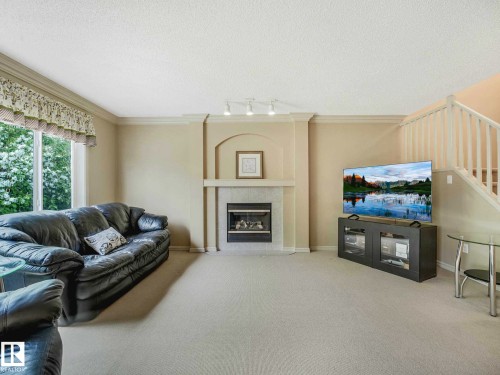 Image quality insufficient for description - 1116 Lincoln Crescent, Edmonton, AB - Indoor Photo Showing Living Room With Fireplace