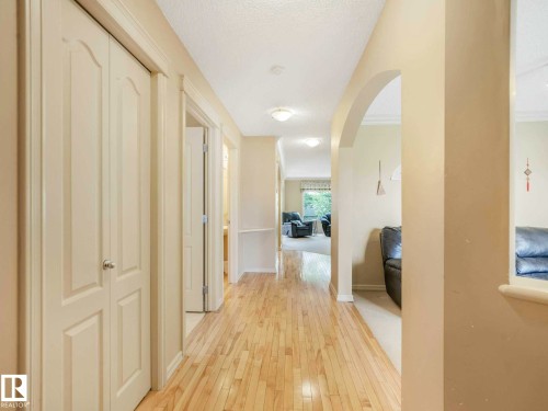 Hallway featuring wood-finish flooring, light neutral wall tones, and recessed ceiling lighting - 1116 Lincoln Crescent, Edmonton, AB - Indoor Photo Showing Other Room