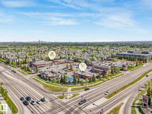 Aerial perspective showcasing a commercial development with multiple buildings and ample surface parking - 1116 Lincoln Crescent, Edmonton, AB - Outdoor With View