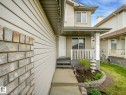 Two-story residential exterior featuring light-toned siding and brick accents - 1116 Lincoln Crescent, Edmonton, AB  - Outdoor With Deck Patio Veranda 