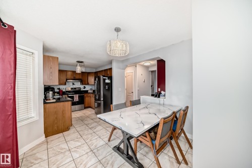 Kitchen and dining area featuring ceramic tile flooring - 8 Campbell Court, Leduc, AB 