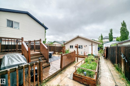 Multi-level wood deck featuring integrated stairs and railings - 8 Campbell Court, Leduc, AB 