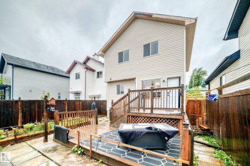 Two-story home with light-colored siding - 8 Campbell Court, Leduc, AB 
