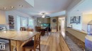 Kitchen island with granite-finish countertop and built-in dishwasher - 4011 Meier Avenue, Drayton Valley, AB 