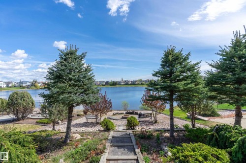 Landscaped backyard featuring a tranquil waterscape - 16103 89 Street, Edmonton, AB - Outdoor With Body Of Water With View