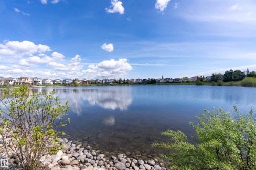 Expansive waterfront property featuring a tranquil lake with clear reflections - 16103 89 Street, Edmonton, AB - Outdoor With Body Of Water With View
