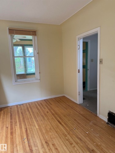 Hardwood flooring with natural finish. - 9740 87 Avenue, Edmonton, AB 
