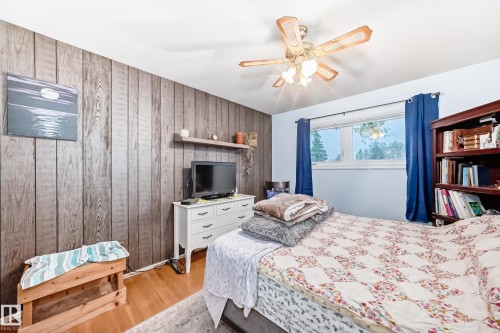 Wood-finish accent wall providing textural depth - 8006 159 Street, Edmonton, AB 