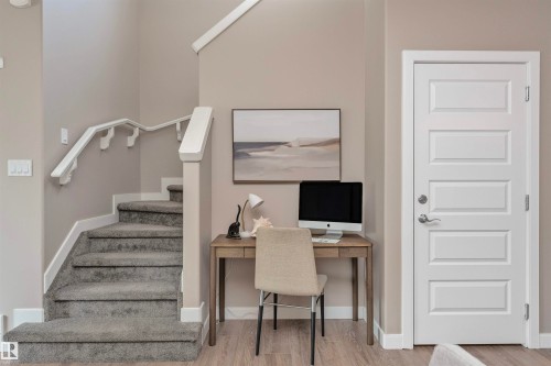 Staircase featuring gray carpet treads and a white painted handrail - 22124 85 Avenue, Edmonton, AB - Indoor Photo Showing Other Room