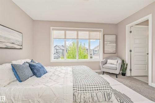 Spacious bedroom with neutral wall tones and carpeted flooring - 22124 85 Avenue, Edmonton, AB - Indoor Photo Showing Bedroom