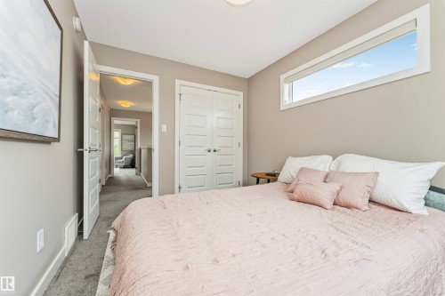 Bedroom featuring a high horizontal window, neutral wall paint, and gray carpet - 22124 85 Avenue, Edmonton, AB - Indoor Photo Showing Bedroom