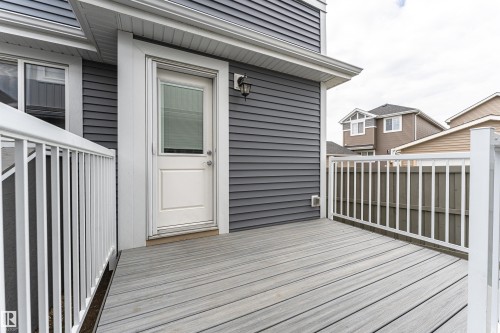 Exterior deck featuring composite decking and white railing - 22124 85 Avenue, Edmonton, AB - Outdoor With Exterior
