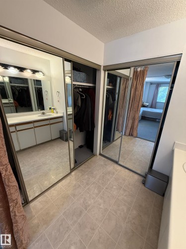 Mirror-front closets providing expansive storage - 225 4404 122 Street, Edmonton, AB 