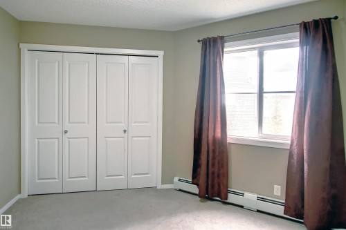 Light-colored carpeting complementing neutral wall tones - 215 1510 Watt Drive, Edmonton, AB 