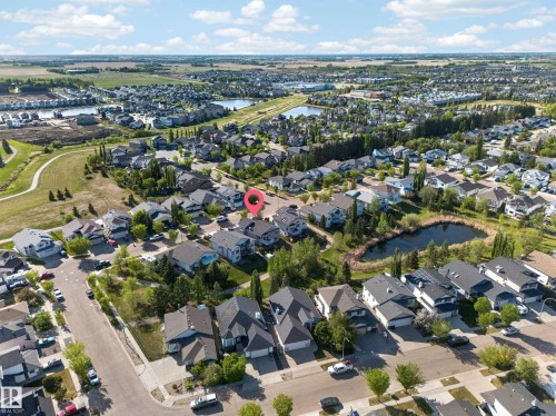 Aerial perspective of a residential neighborhood featuring established homes with varying rooflines - 4113 59 Street, Beaumont, AB 