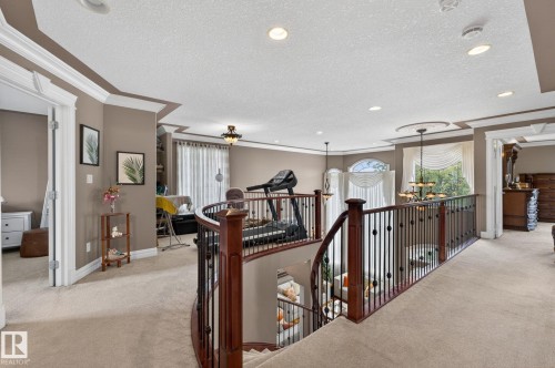 Entry foyer featuring double doors with arched stained glass inserts and a transom window - 1508 Palmer Close, Edmonton, AB 