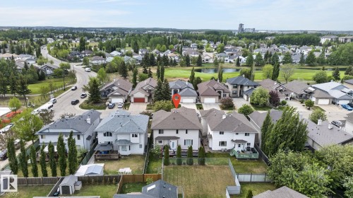 Recessed lighting illuminates this expansive space featuring tray ceilings and tile flooring - 1508 Palmer Close, Edmonton, AB 