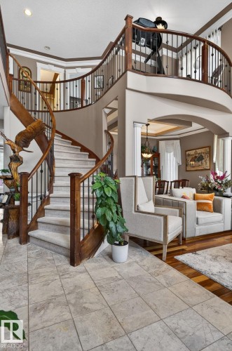 Concrete exterior staircase with white metal railings, leading to a lower-level entry - 1508 Palmer Close, Edmonton, AB 