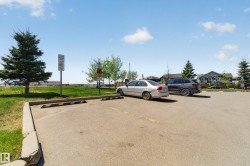 Paved parking area with marked spaces and concrete curbing - 