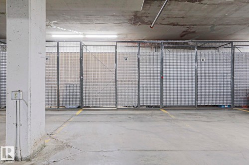 Dedicated storage cages with metal grate construction - 117 160 Magrath Road, Edmonton, AB - Indoor Photo Showing Garage