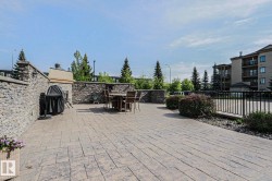 Expansive outdoor patio featuring stamped concrete flooring - 