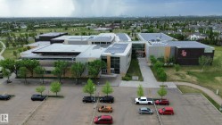 Modern institutional building featuring a multi-level design with extensive solar panel installations on the roof - 