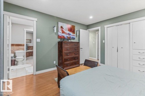 Interior room featuring light wood-finish flooring and a light green wall color - 6720 29 Avenue, Edmonton, AB 