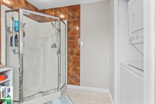 Glass-enclosed shower stall with a handheld shower fixture - 6720 29 Avenue, Edmonton, AB 