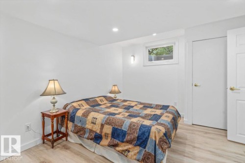Room featuring light wood-finish flooring and white baseboards - 6720 29 Avenue, Edmonton, AB 