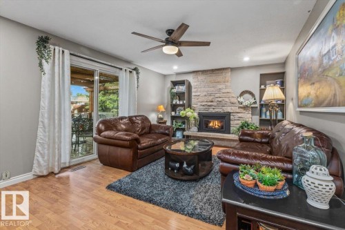 Living area featuring wood-finish flooring and recessed lighting - 6720 29 Avenue, Edmonton, AB 