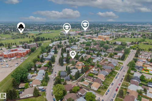 Aerial view showcasing a residential neighborhood with surrounding green spaces and institutional buildings - 6720 29 Avenue, Edmonton, AB 