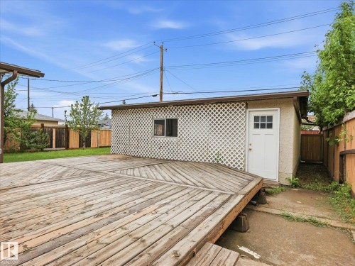 Expansive wood deck with geometric plank layout - 13316 136 Avenue, Edmonton, AB 