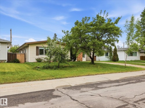 Cream-colored siding exterior with brown trim and shutters - 13316 136 Avenue, Edmonton, AB 