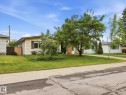 Cream-colored siding exterior with brown trim and shutters - 13316 136 Avenue, Edmonton, AB 