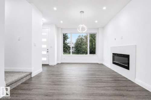 8731 154 Street, Edmonton, AB - Indoor Photo Showing Living Room With Fireplace