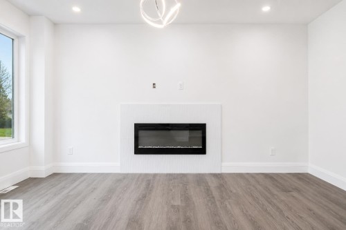 8731 154 Street, Edmonton, AB - Indoor Photo Showing Other Room With Fireplace